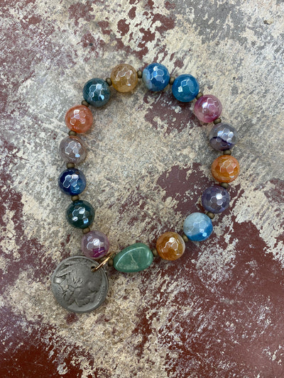 This photo is of the Multi Color Agate with Kingman Turquoise Stretch Stacker Bracelet with Buffalo Nickel. This image was taken at the J.Forks Designs Boutique in downtown Boerne, Texas. 